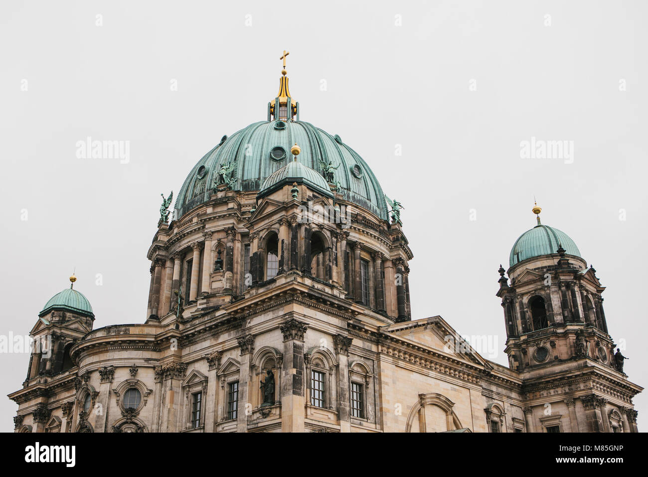 Beautiful old building in the style of neoclassicism and baroque with cross and sculptures Stock Photo