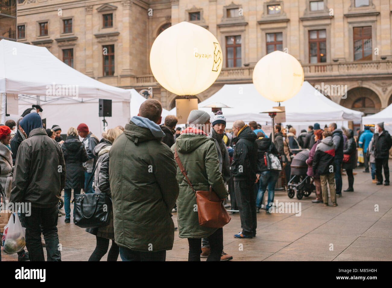 Design market in Prague - crowd of people walks between the designers' shops in square on the background of old building Stock Photo