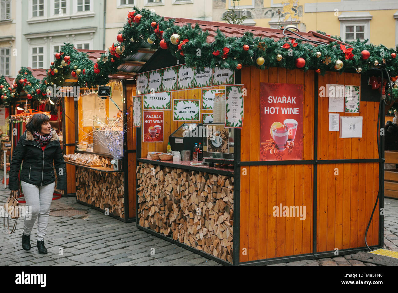 Prague, December 13, 2016: Old Town Square in Prague on Christmas Day. Christmas market in the main square of the city. The woman looks with amazement Stock Photo