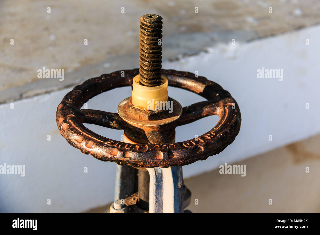 Old hand Wheel of water valve Stock Photo