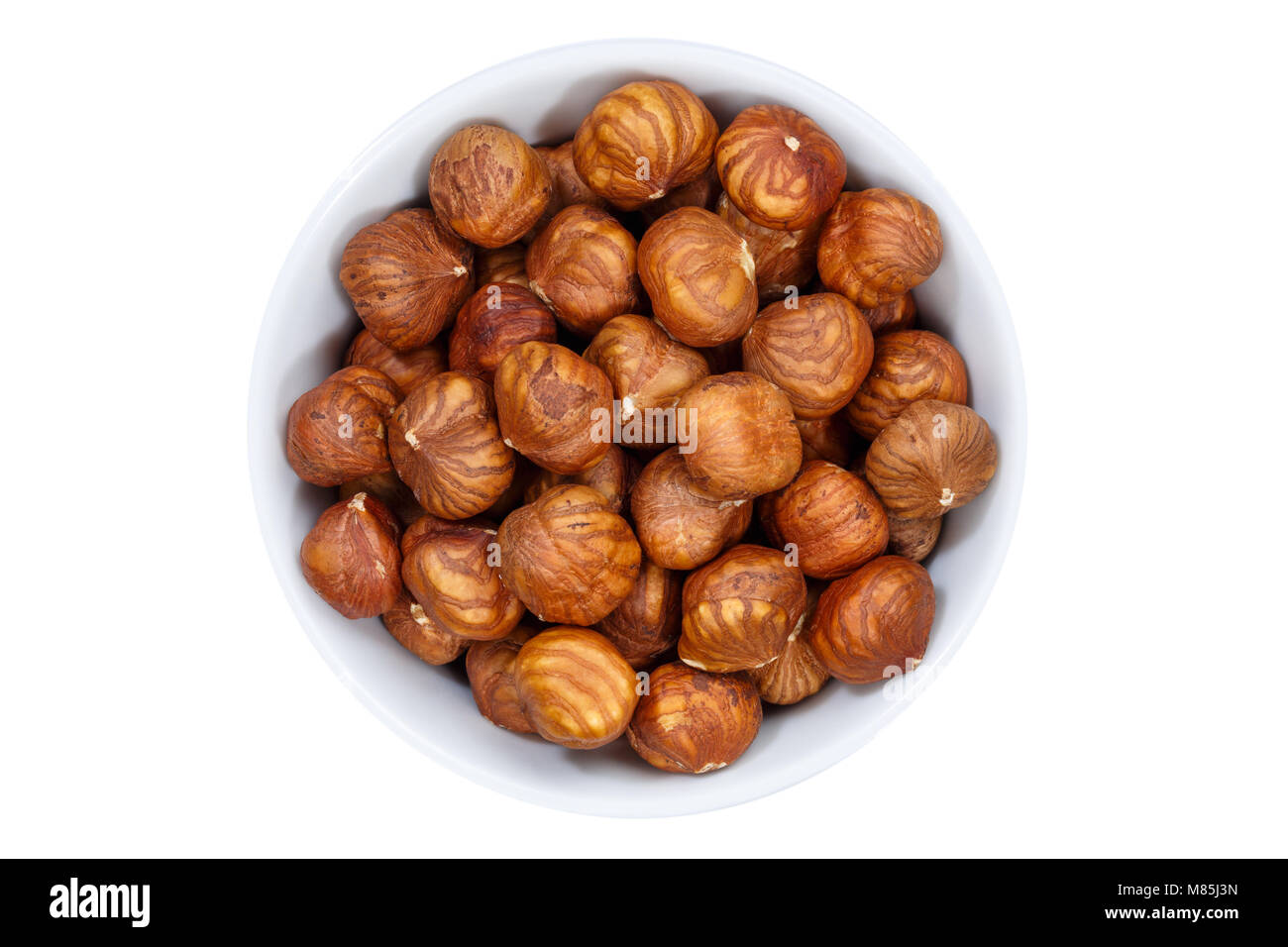 Hazelnuts nuts from above bowl isolated on a white background Stock Photo