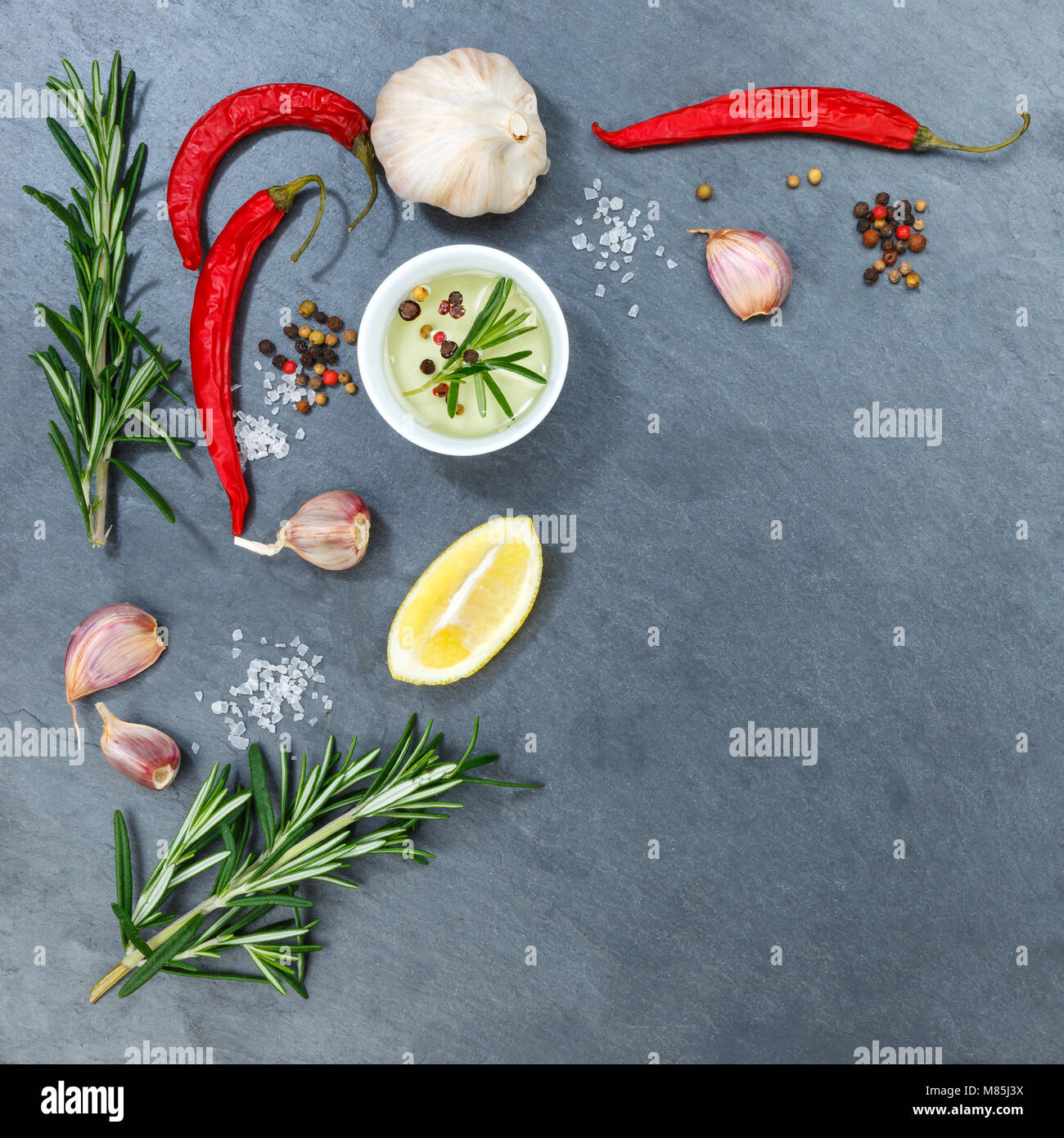Cooking ingredients spices herbs basil square copyspace spicy red hot chili peppers chilli spice Stock Photo
