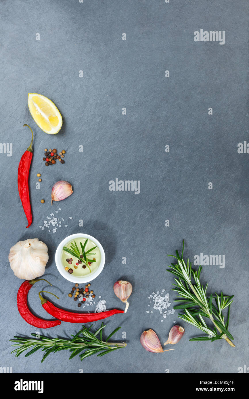 Cooking ingredients spices herbs basil portrait format copyspace spicy red hot chili peppers chilli spice Stock Photo
