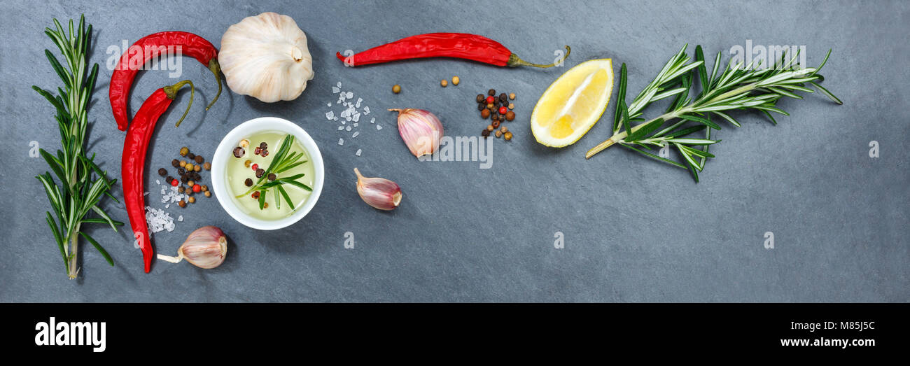 Cooking ingredients spices herbs basil banner copyspace spicy red hot chili peppers chilli spice Stock Photo