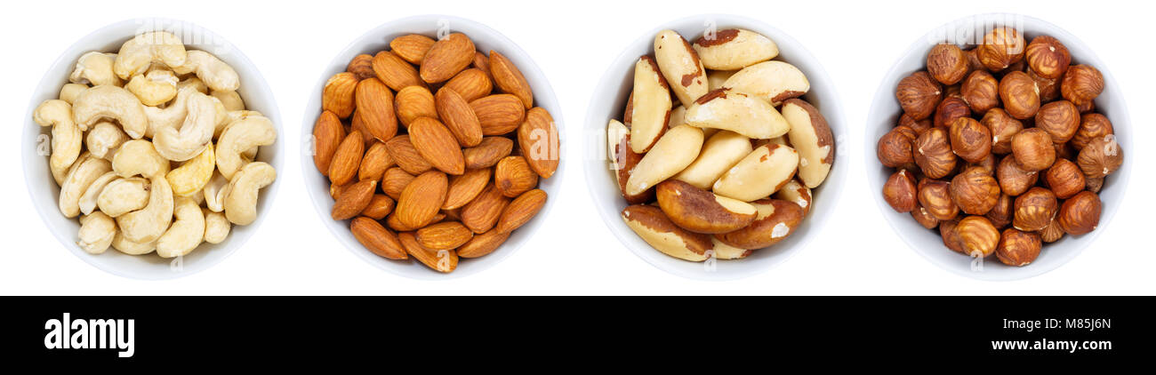 Nuts nut collection in a row from above bowl isolated on a white background Stock Photo