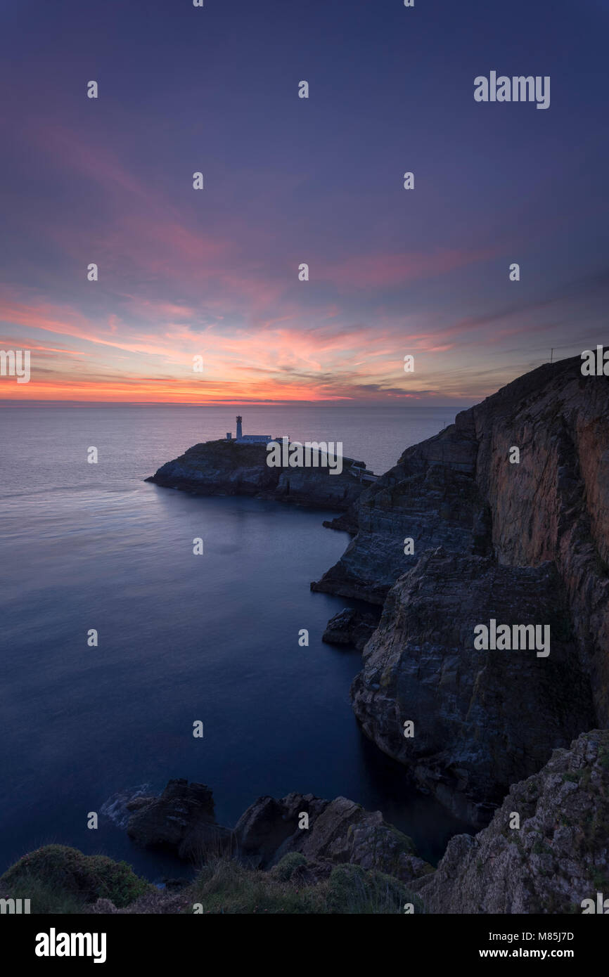 South Stack lighthouse at sunset, Anglesey, North Wales coast Stock Photo