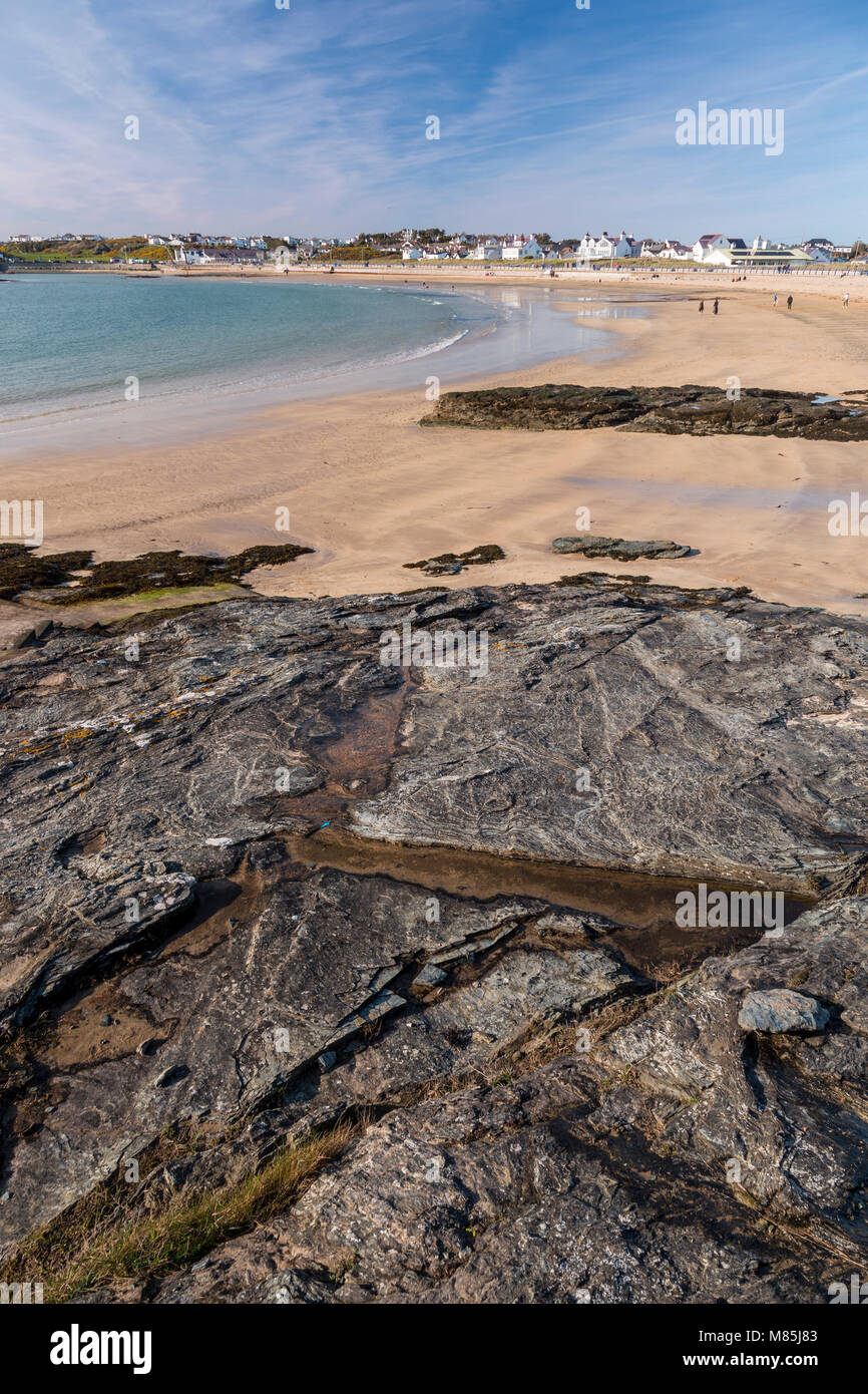 Rocks and sand on the beach at Trearddur Bay, Anglesey, North Wales Coast Stock Photo