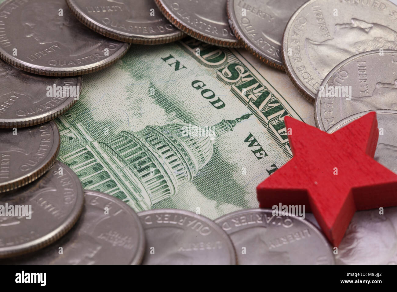 The quarters of USA and red star. A circle of the US quarters with Washington and red