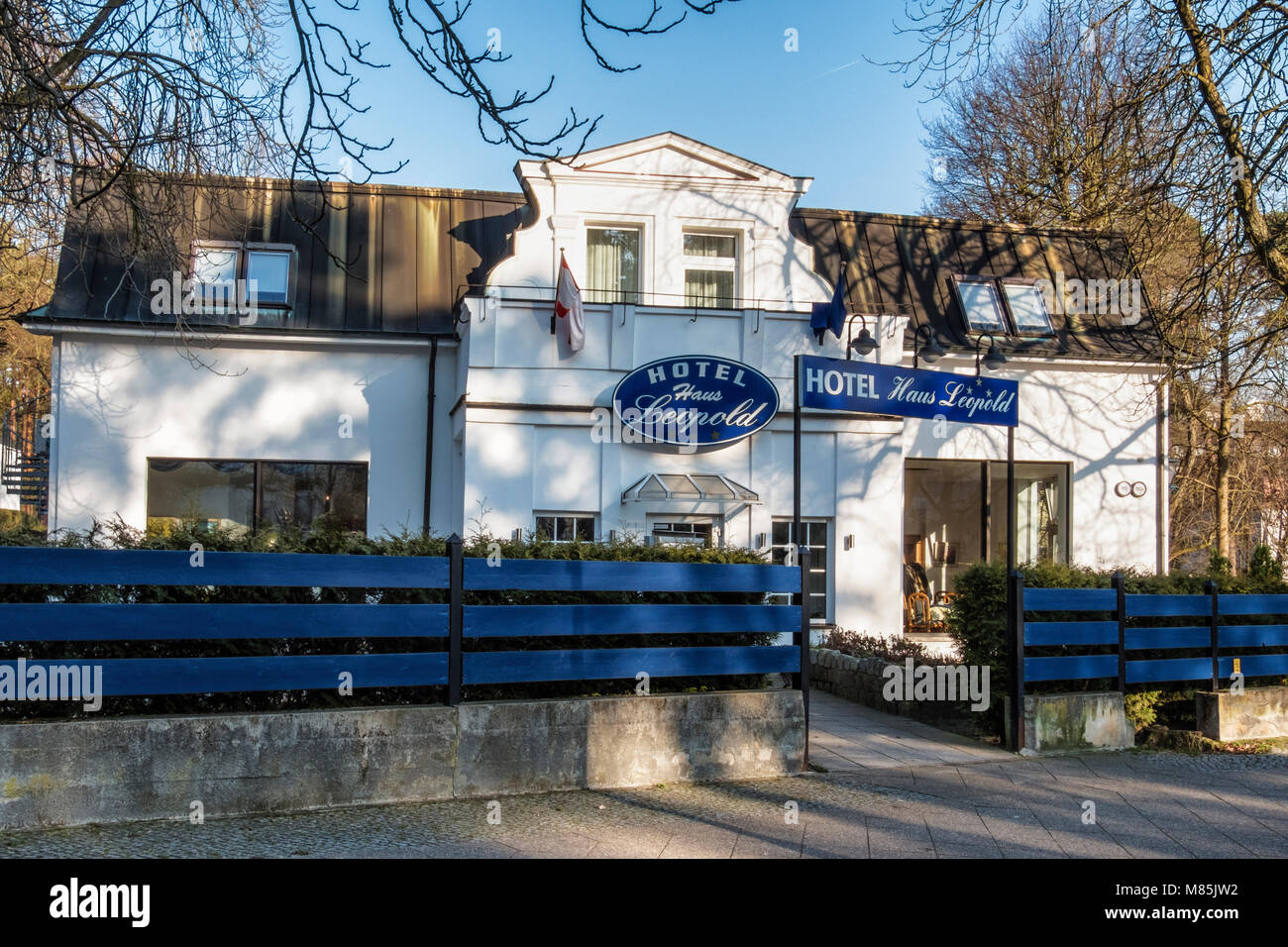 Berlin, Zehlenfdorf. Hotel Haus Leopold exterior..Historic old buidling with white gable Stock Photo