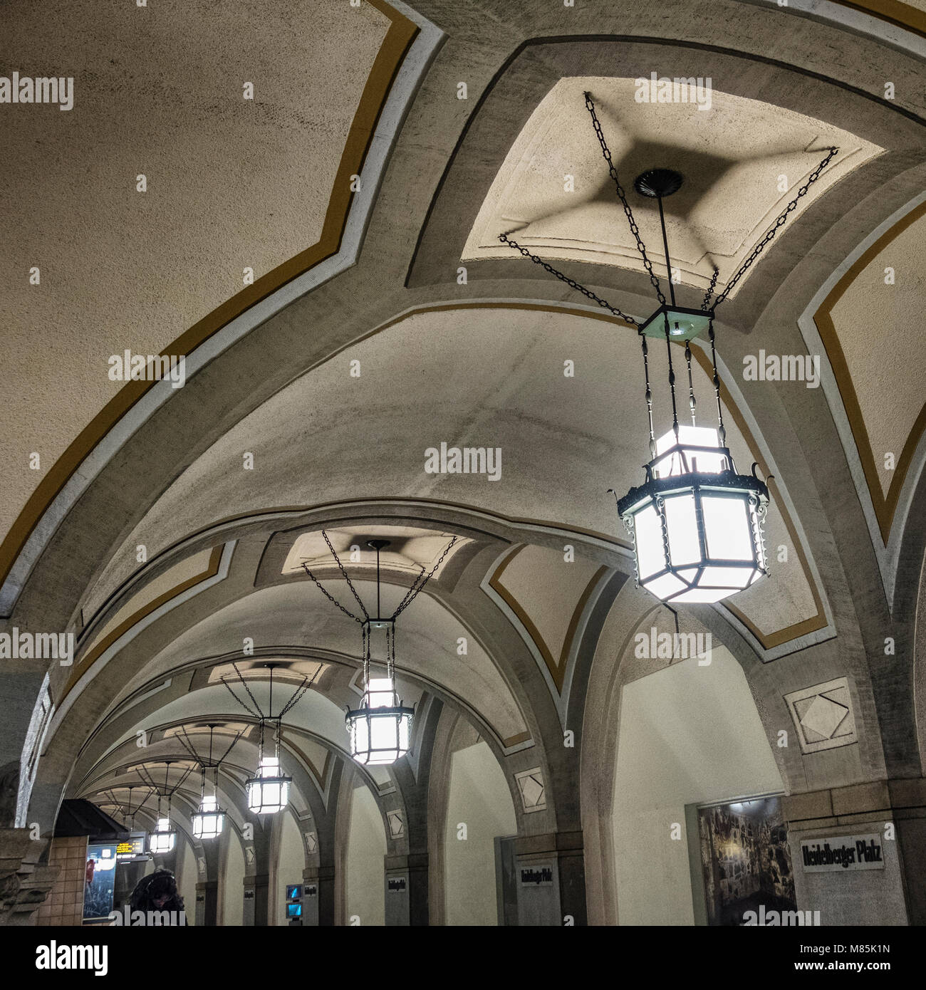 Berlin Wilmersdorf, Heidelberger Platz U3 U-Bahn underground railway station interior has granite pillars, groin vault ceiling & historic pictures.  T Stock Photo