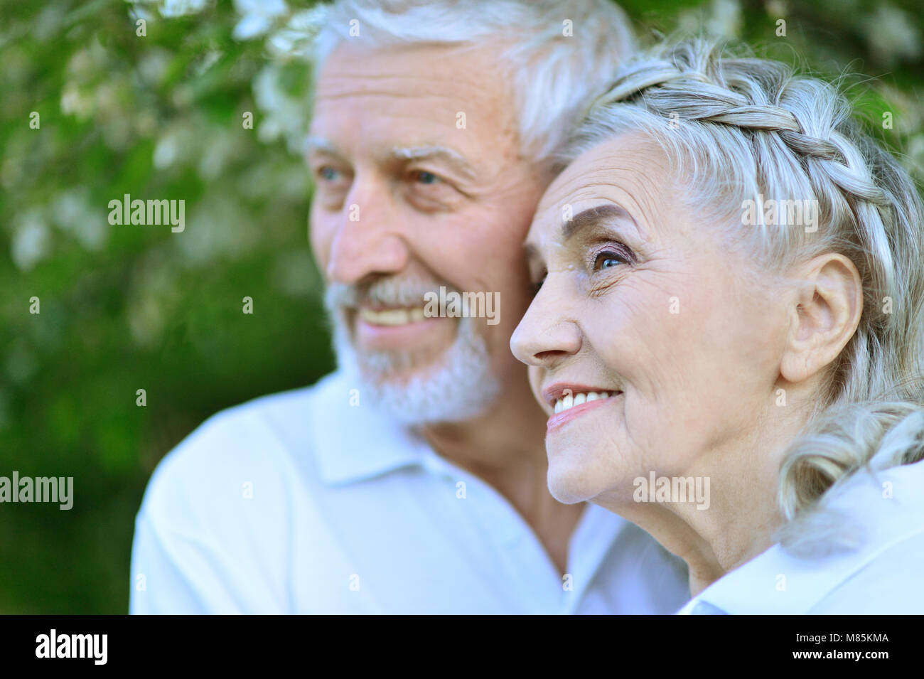 Happy couple hugging in spring park Stock Photo - Alamy
