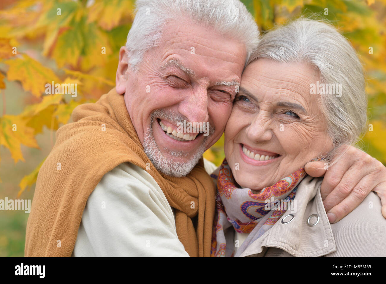 beautiful caucasian senior couple in the park Stock Photo - Alamy