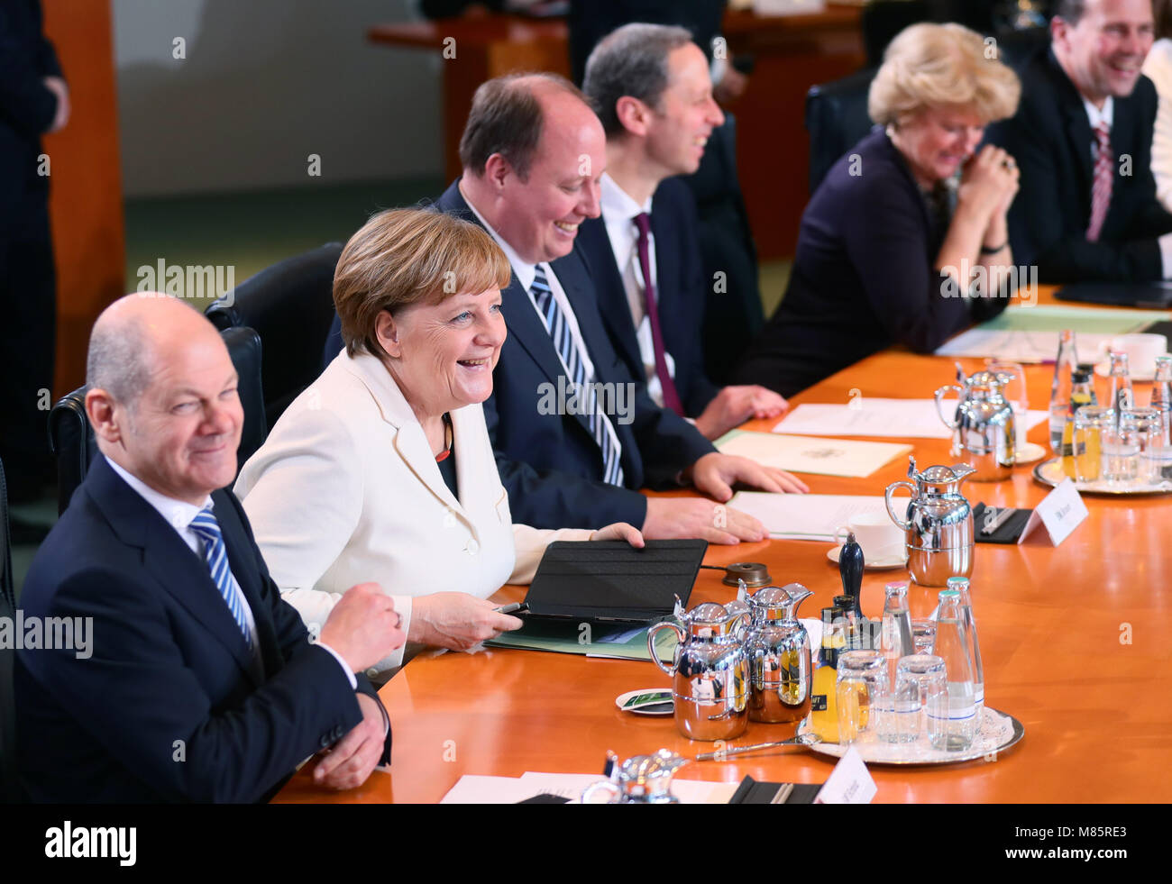 14 March 2018, Germany, Berlin: Olaf Scholz of the Social Democratic Party (SPD), German Minister of Finance, German Chancellor Angela Merkel of the Christian Democratic Union (CDU), Helge Braun (CDU), Chancellery Chief of Staff, Hendrik Hoppenstedt (CDU), State Minister for the cooperation between the Federation and the federal states, Monika Gruetters (CDU), State Minister for Cultural and Media Affairs, and government spokesman Steffen Seibert take part in the first German cabinet meeting at the Federal Chancellery after the swearing-in of the German Chancellor and the German Ministers. Pho Stock Photo