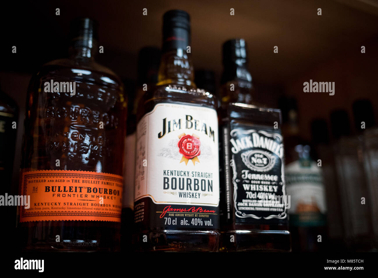14 March 2018, Germany, Hamburg: A variety of whiskey brands from the United States are stacked on a shelf in a supermarket. The President of the European Commission, Jean-Claude Juncker, has announced to take action in light of the recently announced implementation of US tariffs on imported products to the US. The EU commission is currently examining possible import surcharges on US products such as whiskey, motorcycles and peanut butter. Photo: Christian Charisius/dpa Stock Photo
