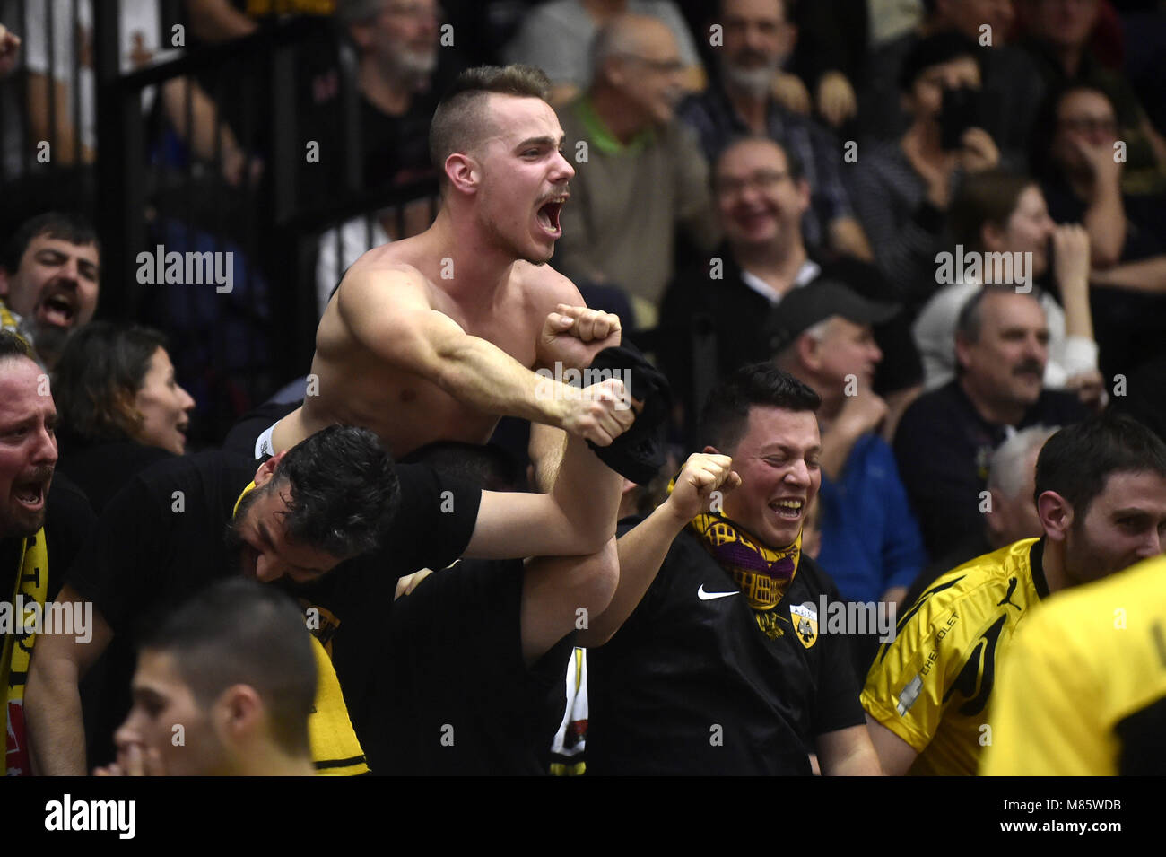 Nymburk, Czech Republic. 14th Mar, 2018. AEK Athens fans celebrate win after the Men's Basketball Champions League match, round of 16, Nymburk vs AEK Athens, in Nymburk, Czech Republic, on March 14, 2018. Credit: Josef Vostarek/CTK Photo/Alamy Live News Stock Photo