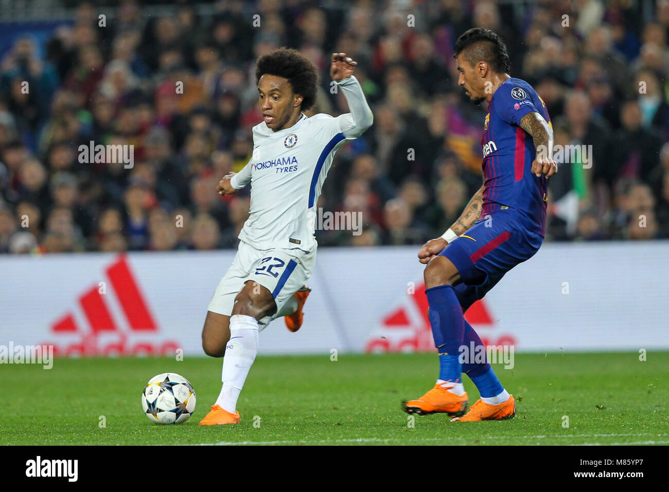 Barcelona, Spain. 14th March 2018; Willian, Chelsea FC player in action with Paulinho, #15 player of FC Barcelona during the 2017/2018 UEFA Champions League Round of 16 game between FC Barcelona and Chelsea at Camp Nou stadium on March 14, 2018 in Barcelona, Spain. Credit: UKKO Images/Alamy Live News Stock Photo