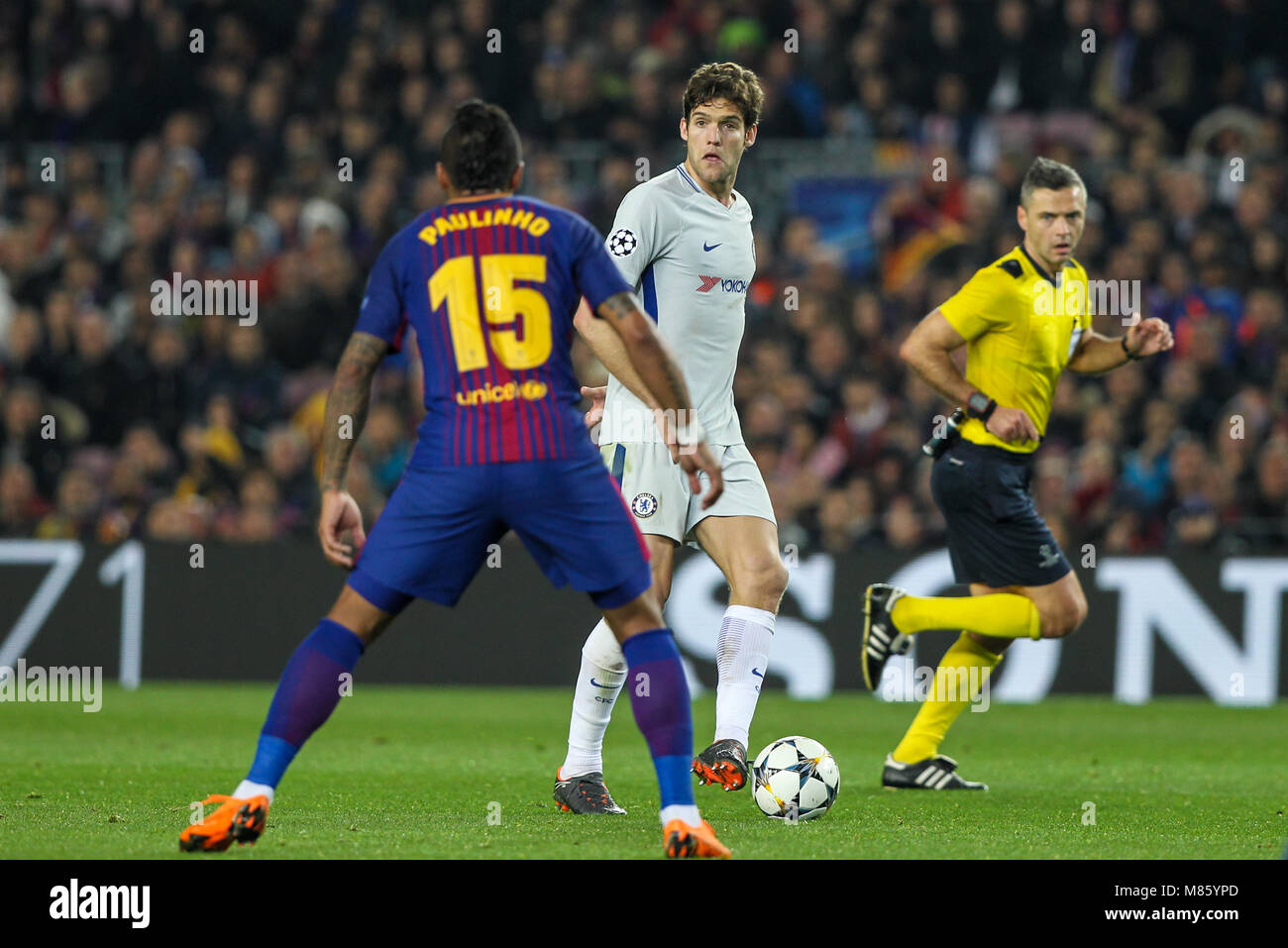 Barcelona, Spain. 14th March 2018; Marcos Alonso, Chelsea FC player in action with Paulinho, #15 player of FC Barcelona during the 2017/2018 UEFA Champions League Round of 16 game between FC Barcelona and Chelsea at Camp Nou stadium on March 14, 2018 in Barcelona, Spain. Credit: UKKO Images/Alamy Live News Stock Photo