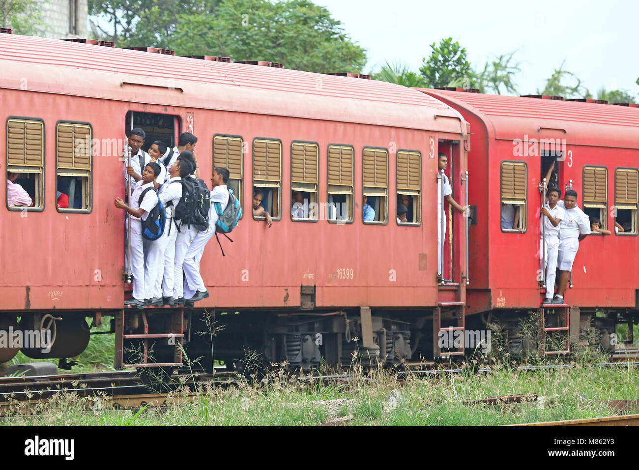 The School Childern Traveling on train footboard after School From