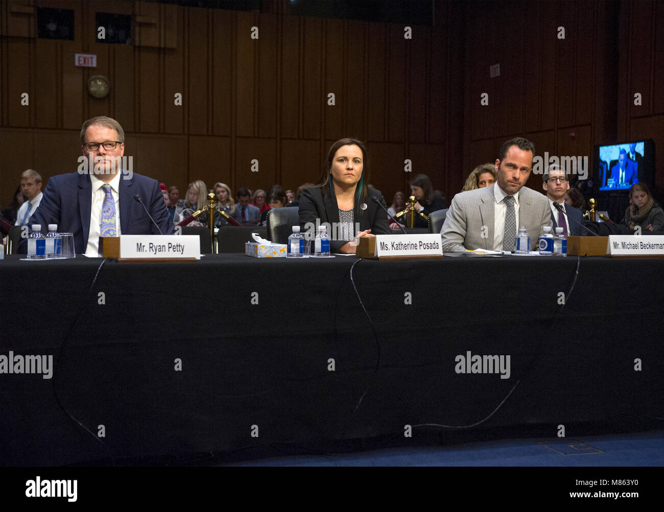 Ryan B. Petty, who's 14 year-old daughter Alaina JoAnn Petty was one of the seventeen people killed at Marjory Stoneman Douglas High School on February 14, 2018, left, Katherine Posada, a 10th-grade English teacher at Marjory Stoneman Douglas High School, center, and Michael Beckerman, President and CEO of the Internet Association, right, testify before the United States Senate Committee on the Judiciary during 'an oversight hearing to examine the Parkland shooting and legislative proposals to improve school safety' on Capitol Hill in Washington, DC on Wednesday, March 14, 2018. Credit: Ron Sa Stock Photo