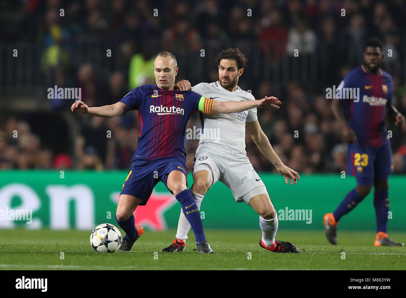 March 14, 2018 - Barcelona, Spain - ANDRES INIESTA of FC Barcelona duels for the ball with CESC FABREGAS of Chelsea FC during the UEFA Champions League, round of 16, 2nd leg football match between FC Barcelona and Chelsea FC at Camp Nou stadium. (Credit Image: © Manuel Blondeau via ZUMA Wire) Stock Photo
