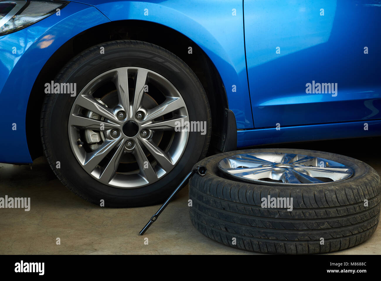 Replacing damaged car wheel service. Fixing damage car wheels Stock