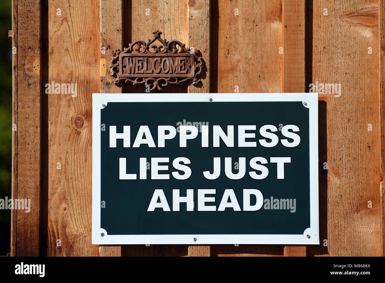 Happiness sign on the entrance to a campground Vancouver Island Canada. Stock Photo