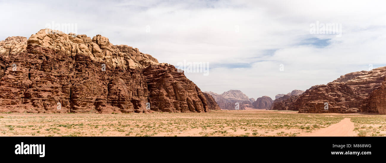 Wadi Rum , The Valley of the Moon, is a valley cut into the sandstone and granite rock in southern Jordan. It is the largest wadi in Jordan. Stock Photo