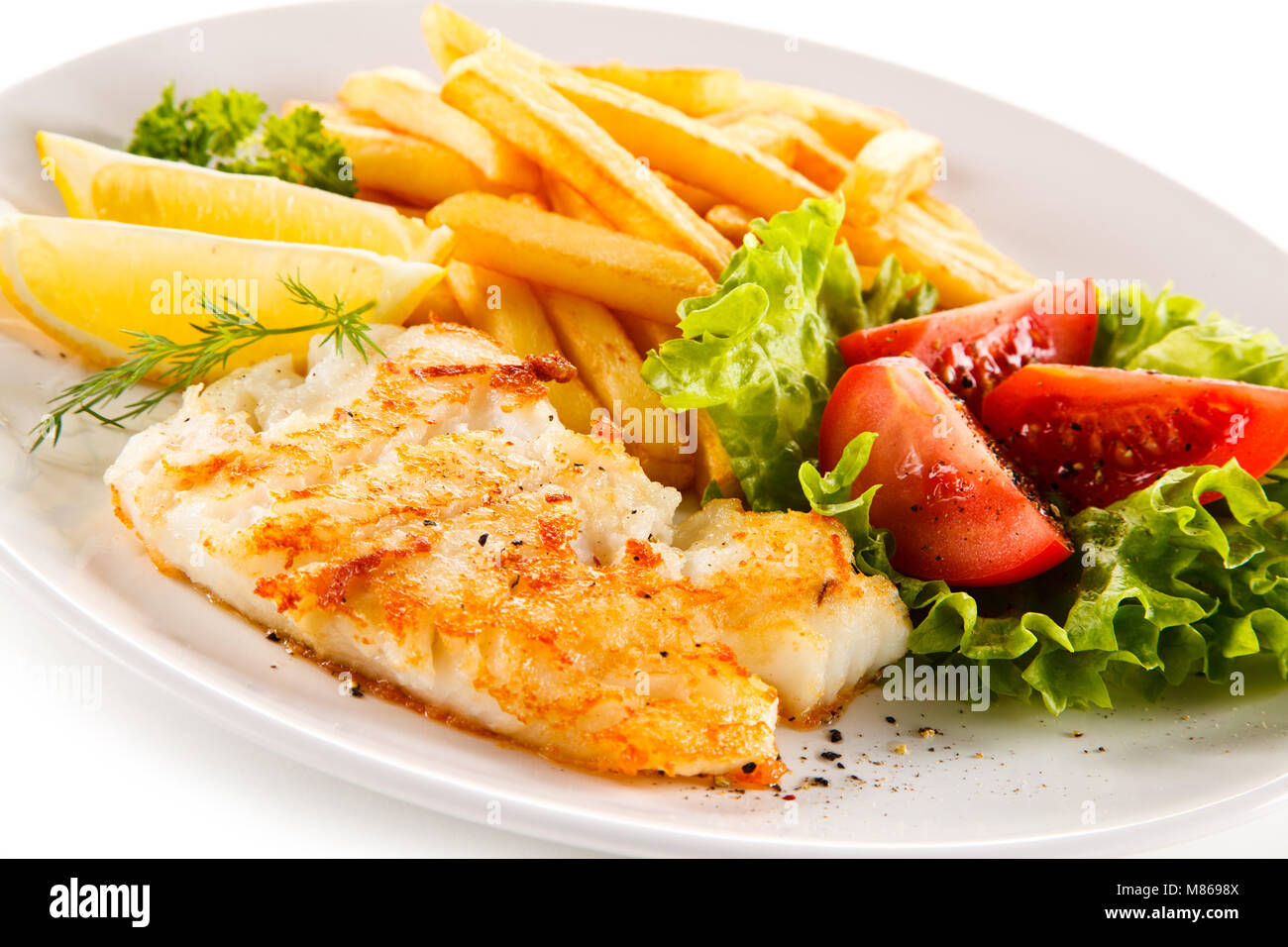 Fried fish fillet with french fries on white background Stock Photo