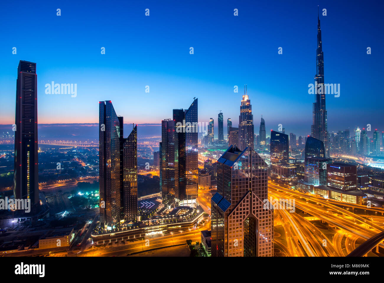 Cityscapes by day and night, featuring Singapore or Dubai.  For Singapore, featuring Marina Bay Sands by the Harbour. Dubai features downtown Dubai. Stock Photo