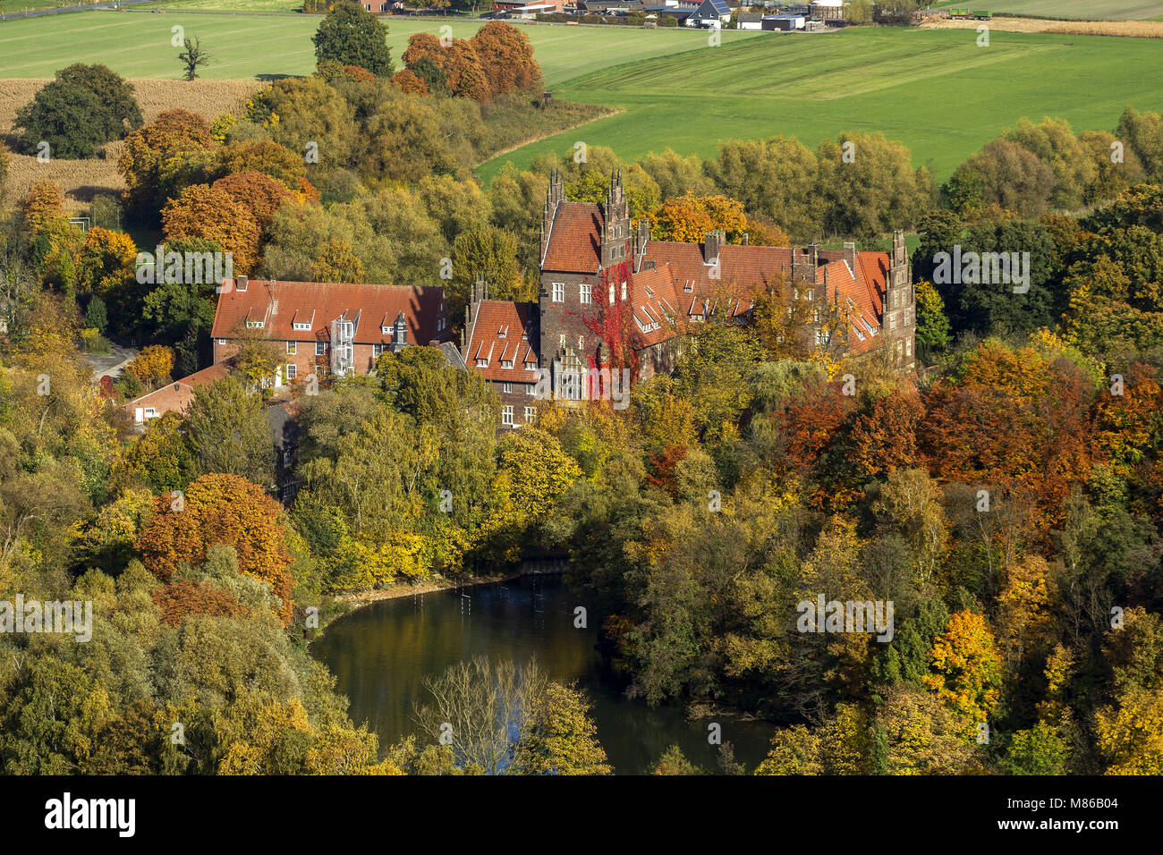 Aerial view, castle Heessen in autumn leaves, boarding school, moated