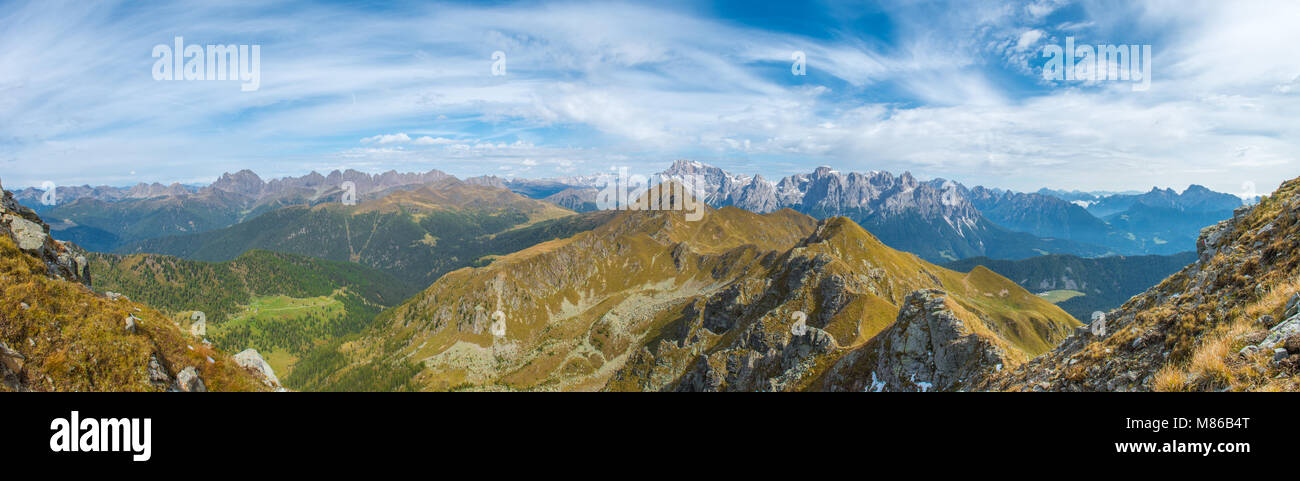 Wonderful panorama, broad view from the summit, top.Mountain range, Italian Alps, perfect visibility on forests and amazing peaks, valley below. Stock Photo