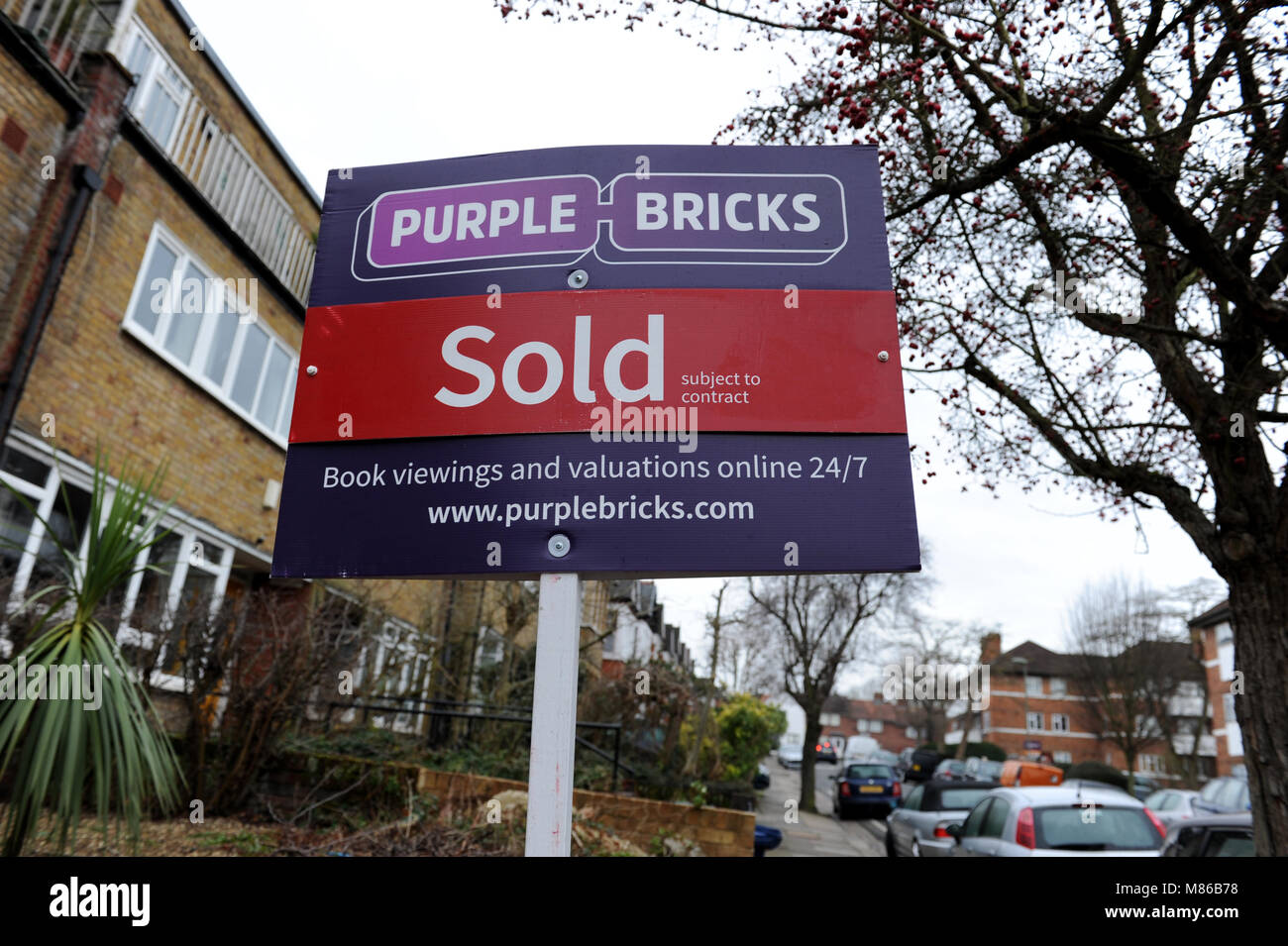 A Purple Bricks sold estate agent sign outside a house in Muswell Hill, London Stock Photo