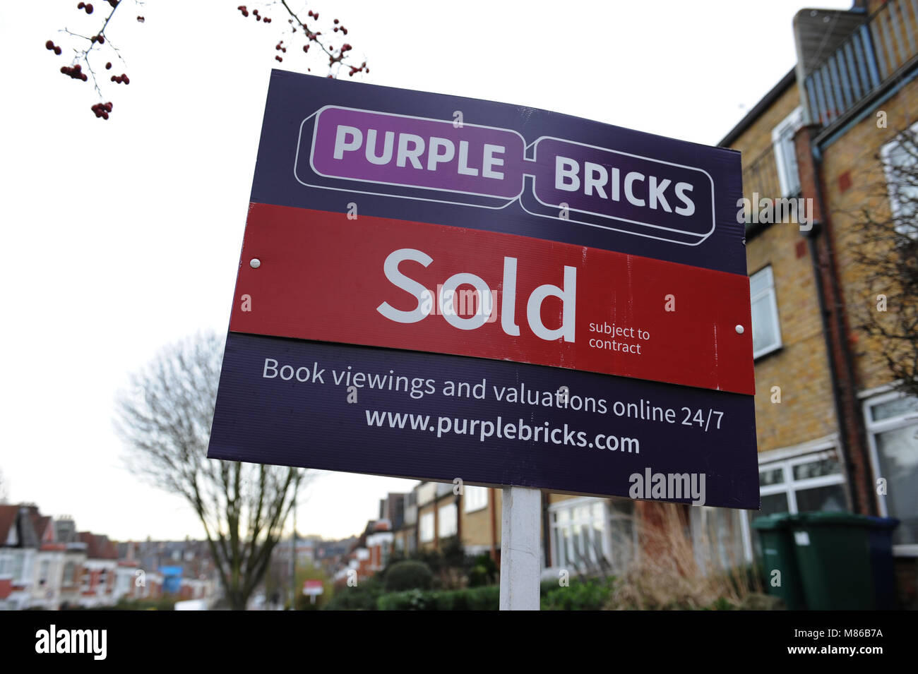 A Purple Bricks sold estate agent sign outside a house in Muswell Hill