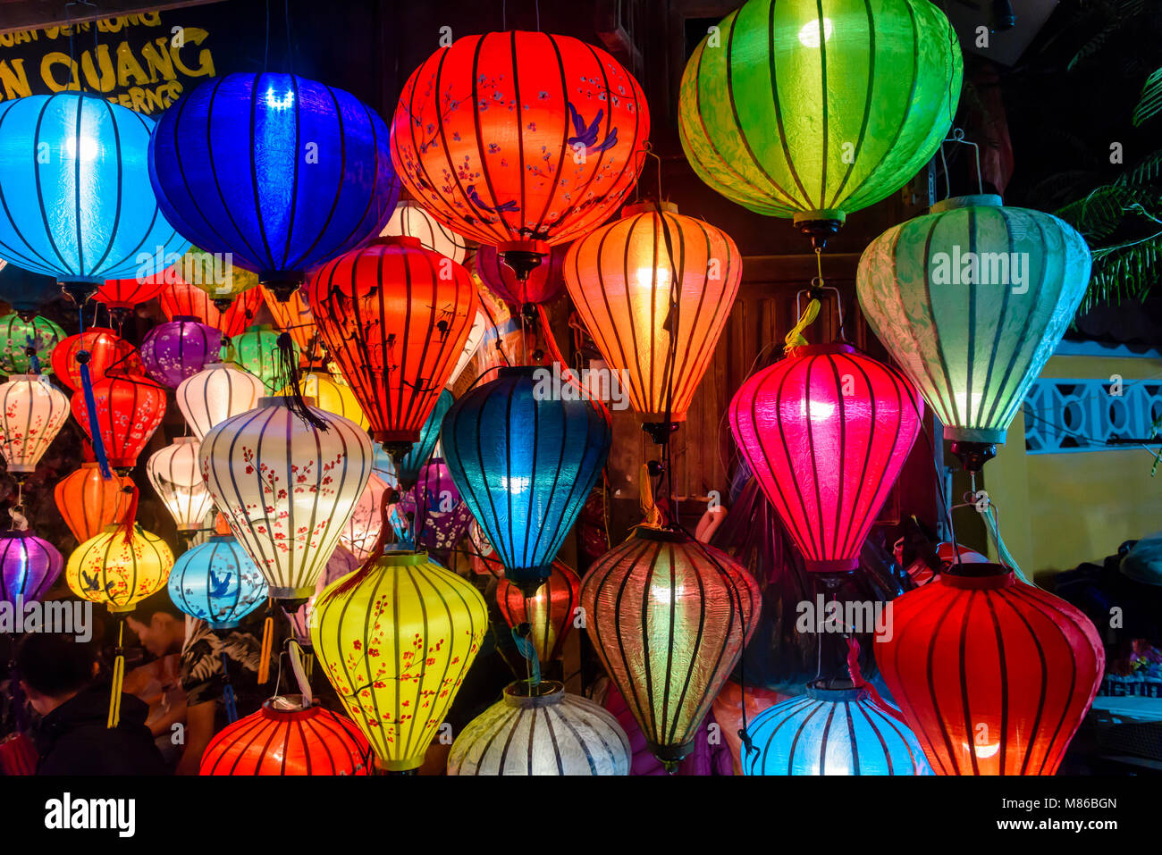 Colourful cloth lanterns lamp light shades hanging outside in Hoi An, Vietnam Stock Photo