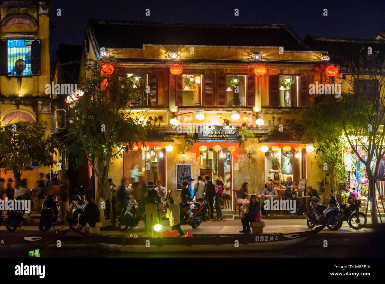 Colourful cloth lanterns lamp light shades hanging outside shops and
