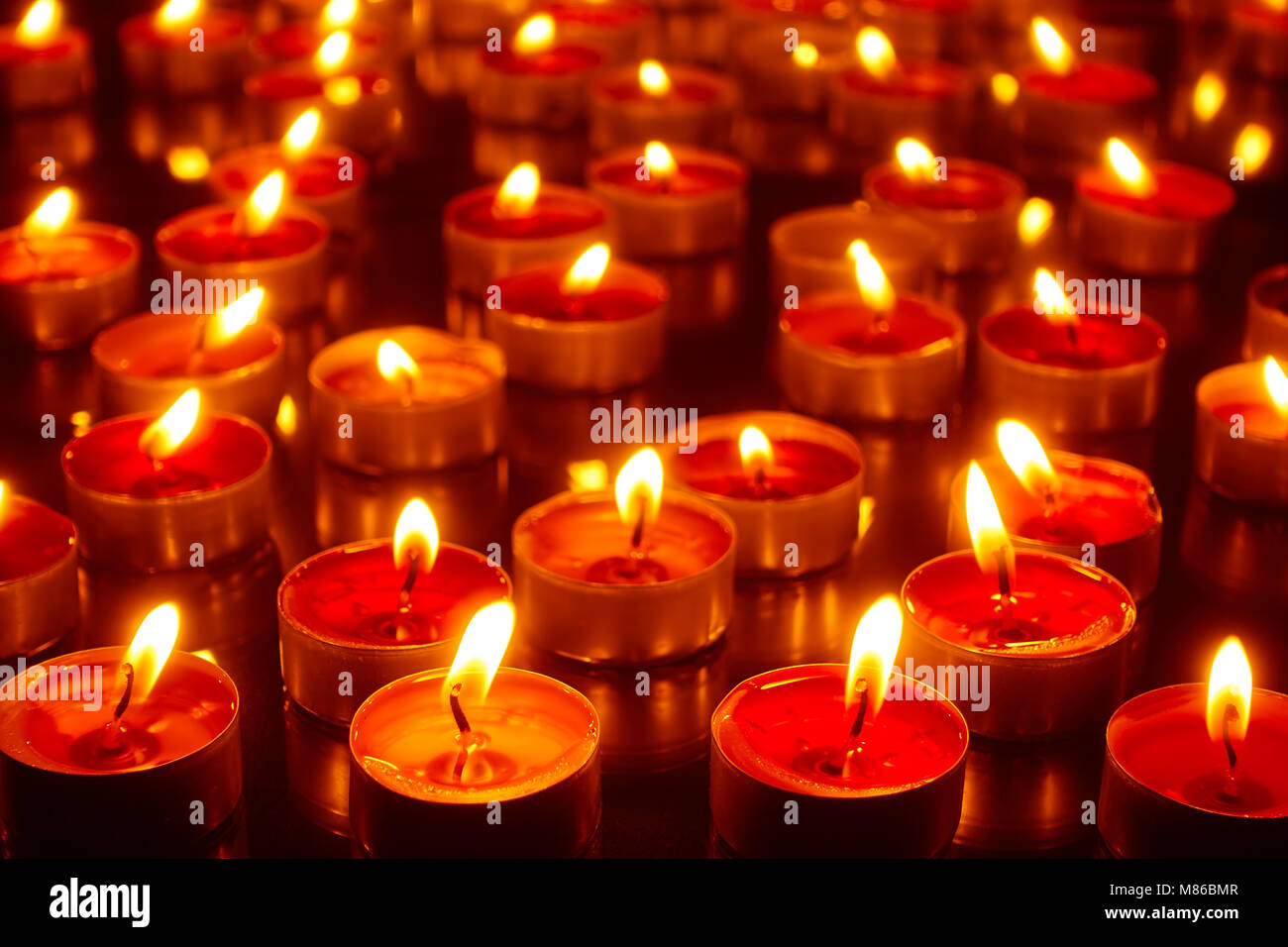 Lots burning church candles closeup Stock Photo Alamy
