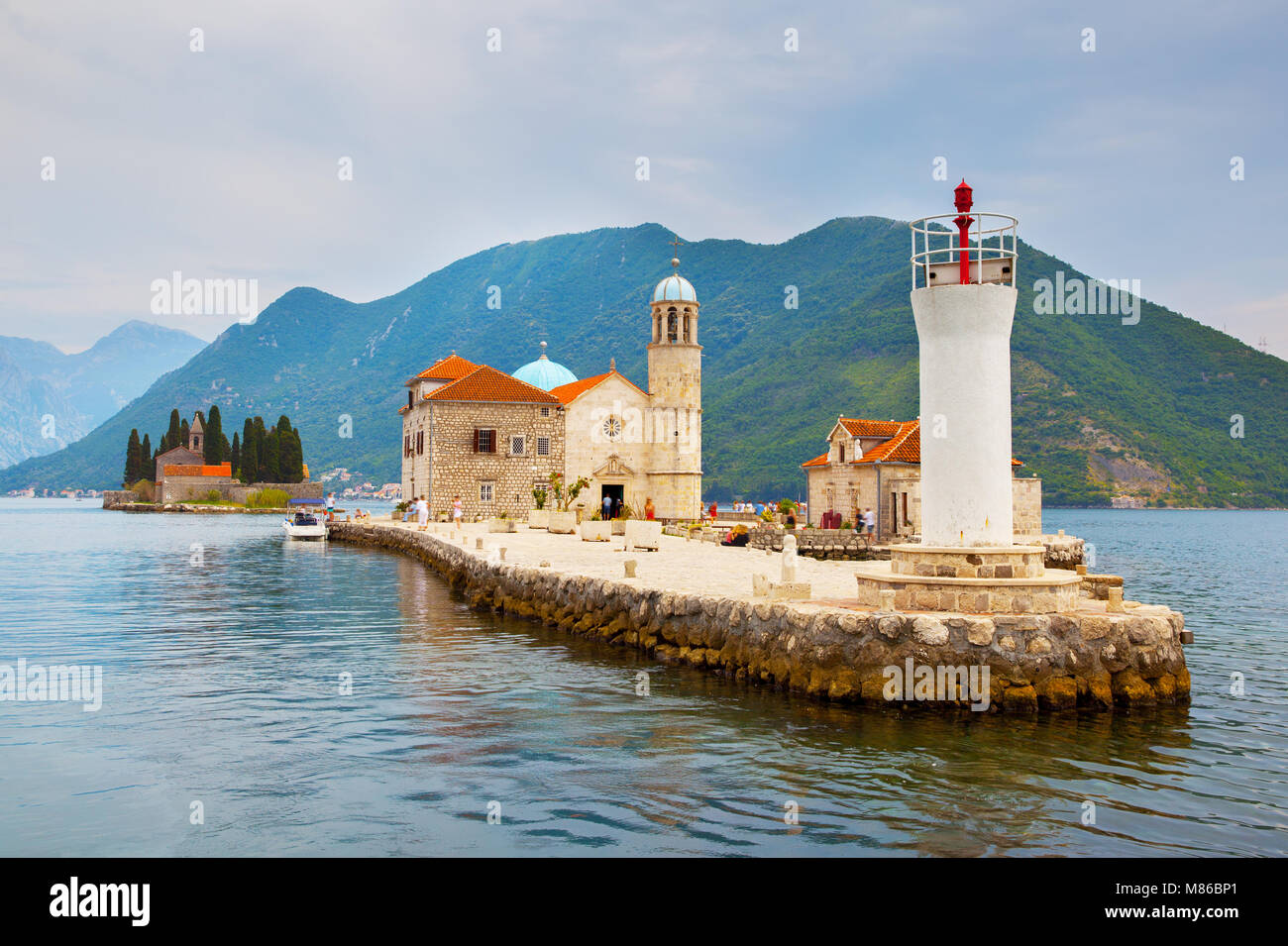 Our Lady of the Rocks church and lighthouse on small island in the Kotor Bay near Perast town, Montenegro Stock Photo