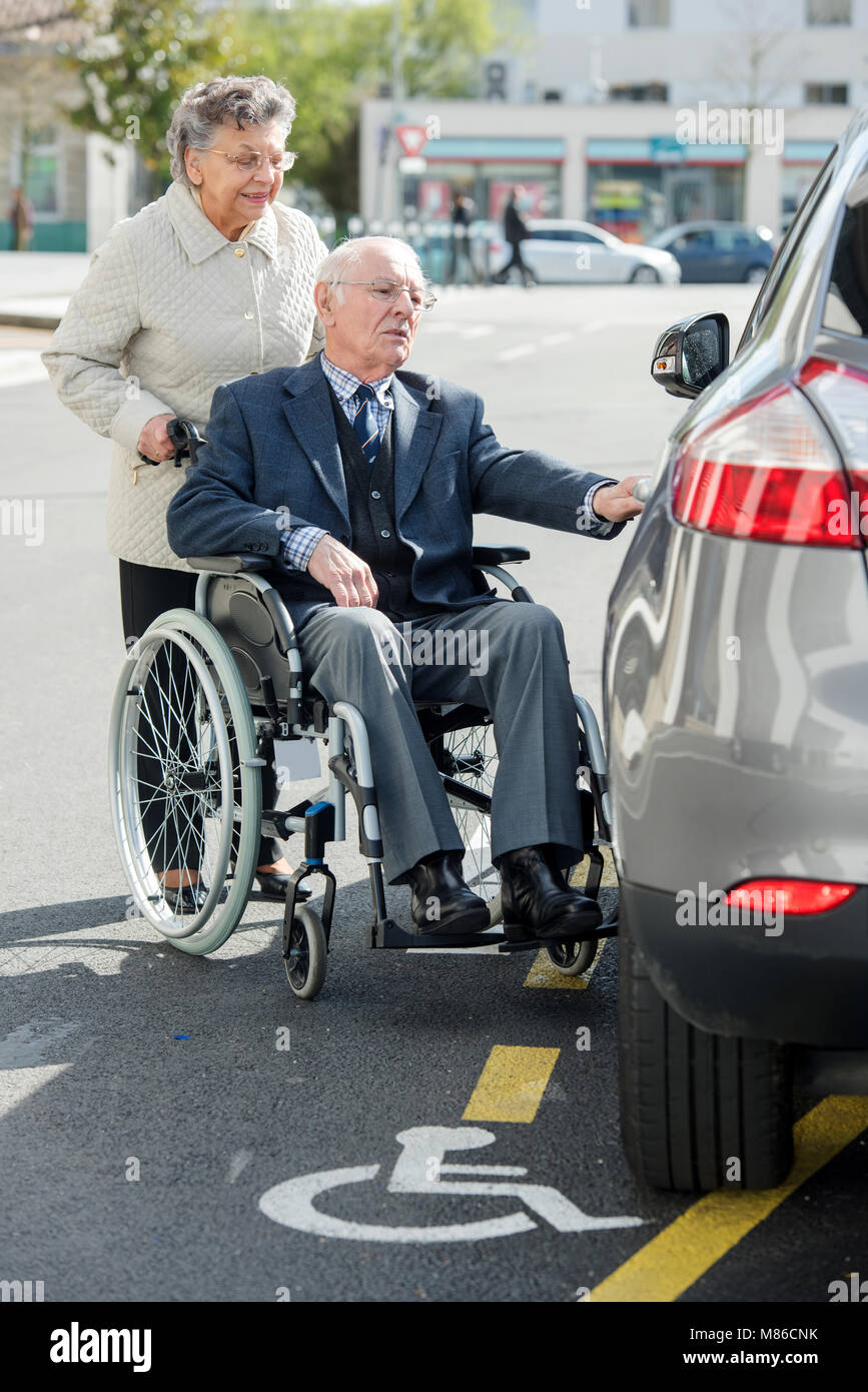 senior man in wheelchair with wife Stock Photo Alamy