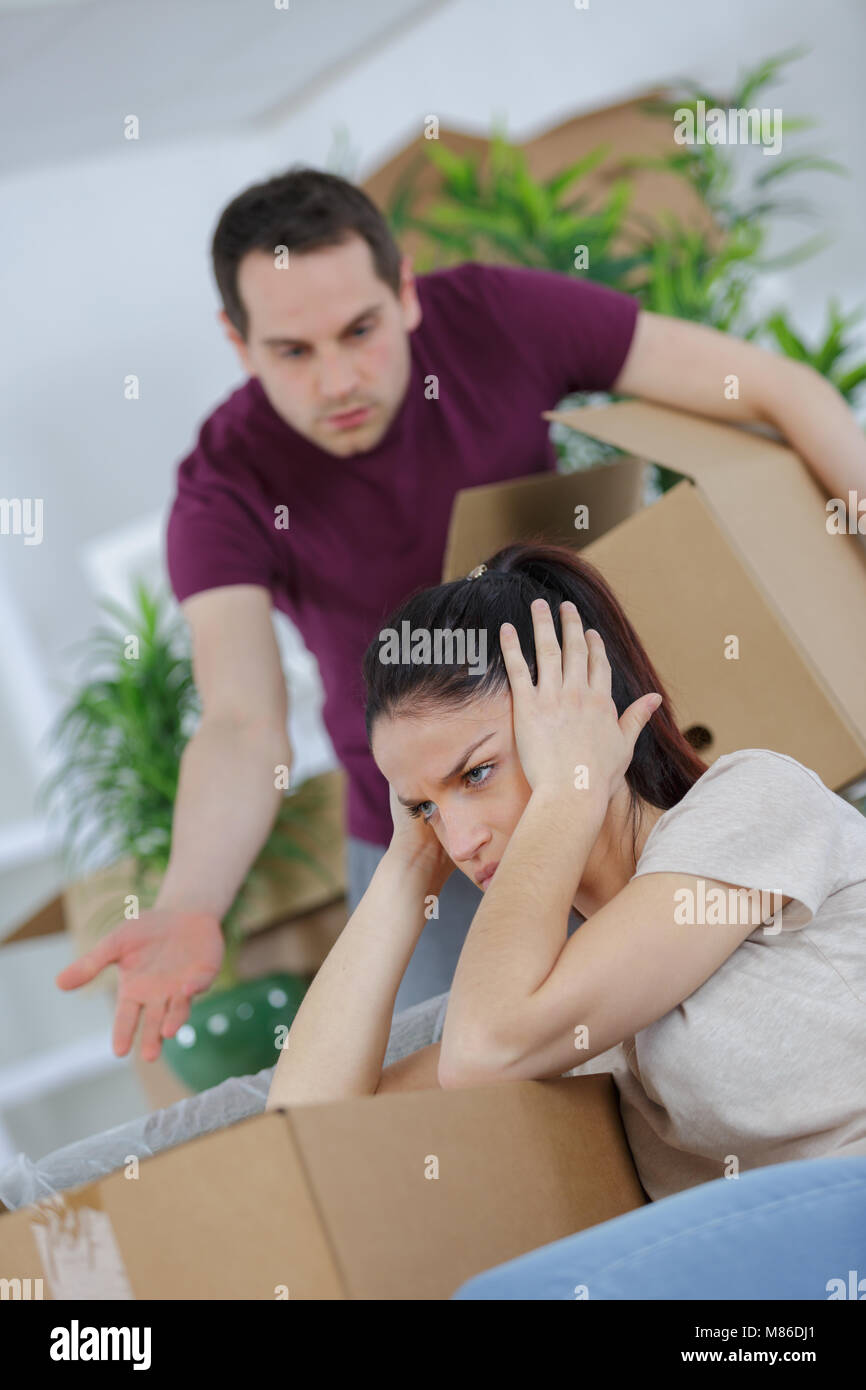 unhappy couple having argument while packing Stock Photo - Alamy