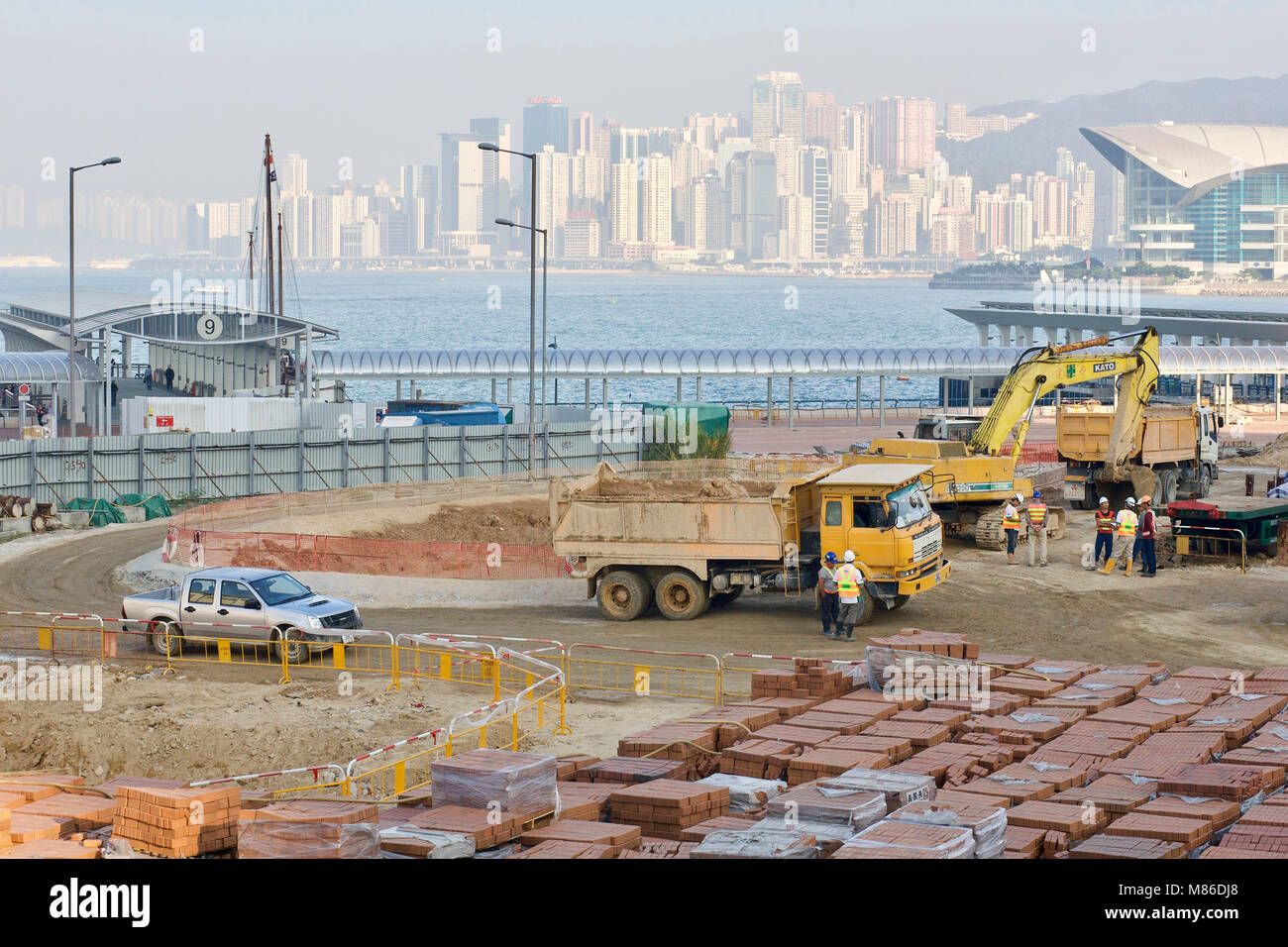 A construction site of the new polders in front of the island of Hong Kong at Central pier. in the background the financial center and Admiralty . Stock Photo