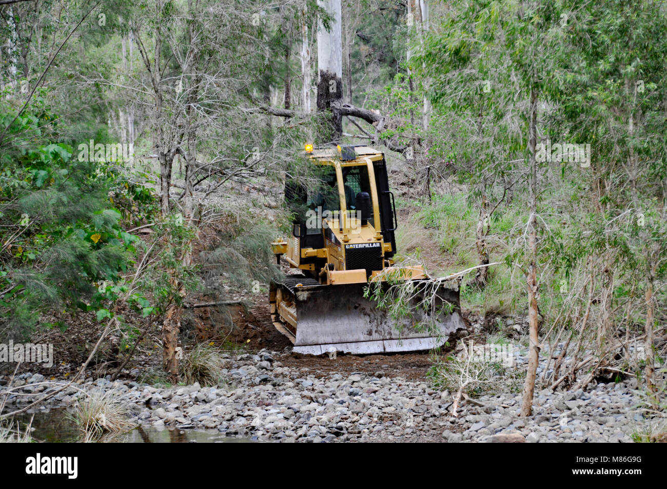 D4 DOZER WORKING TO CLEAR WATER WAYS Stock Photo