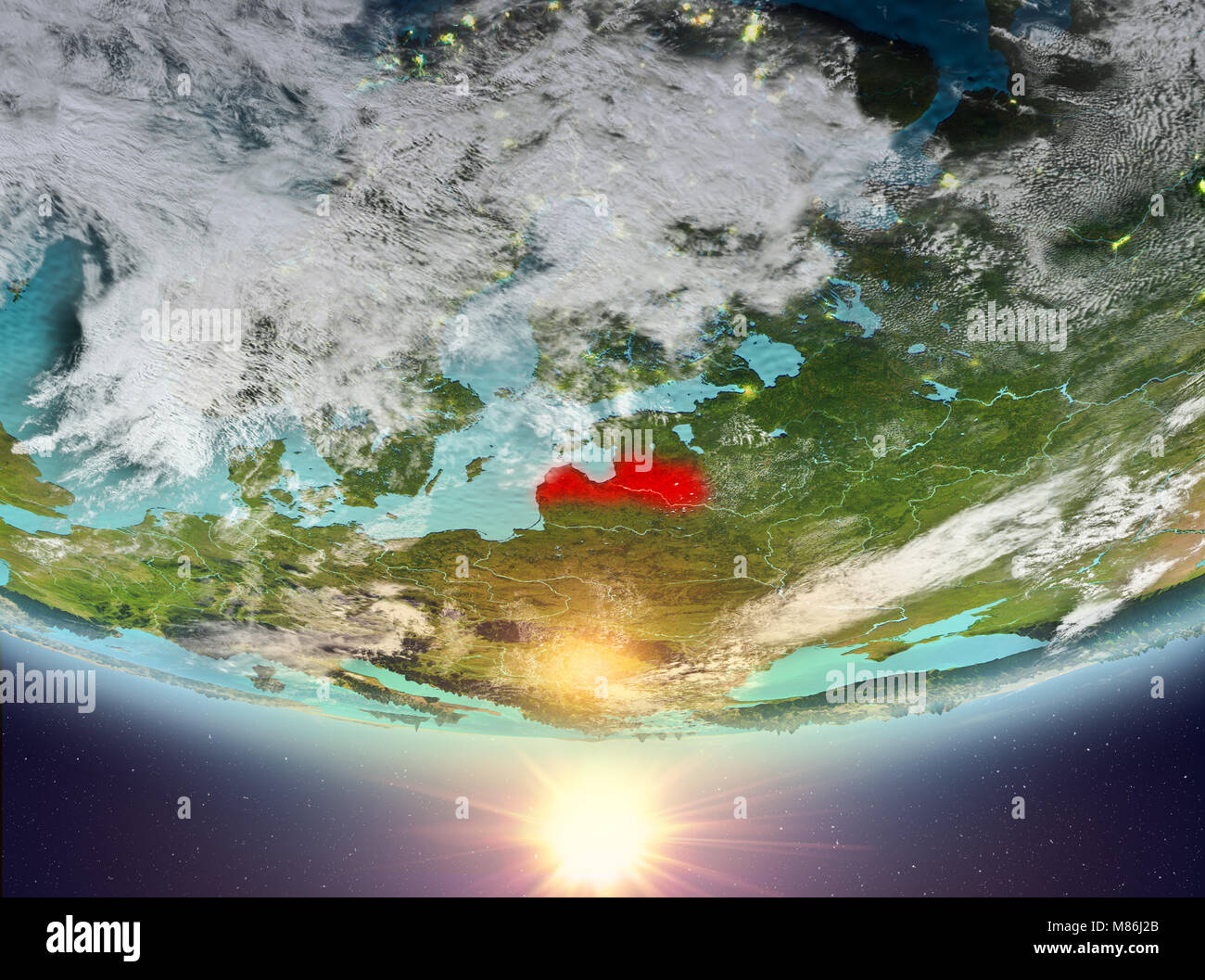 Latvia during sunrise highlighted in red on planet Earth with clouds ...