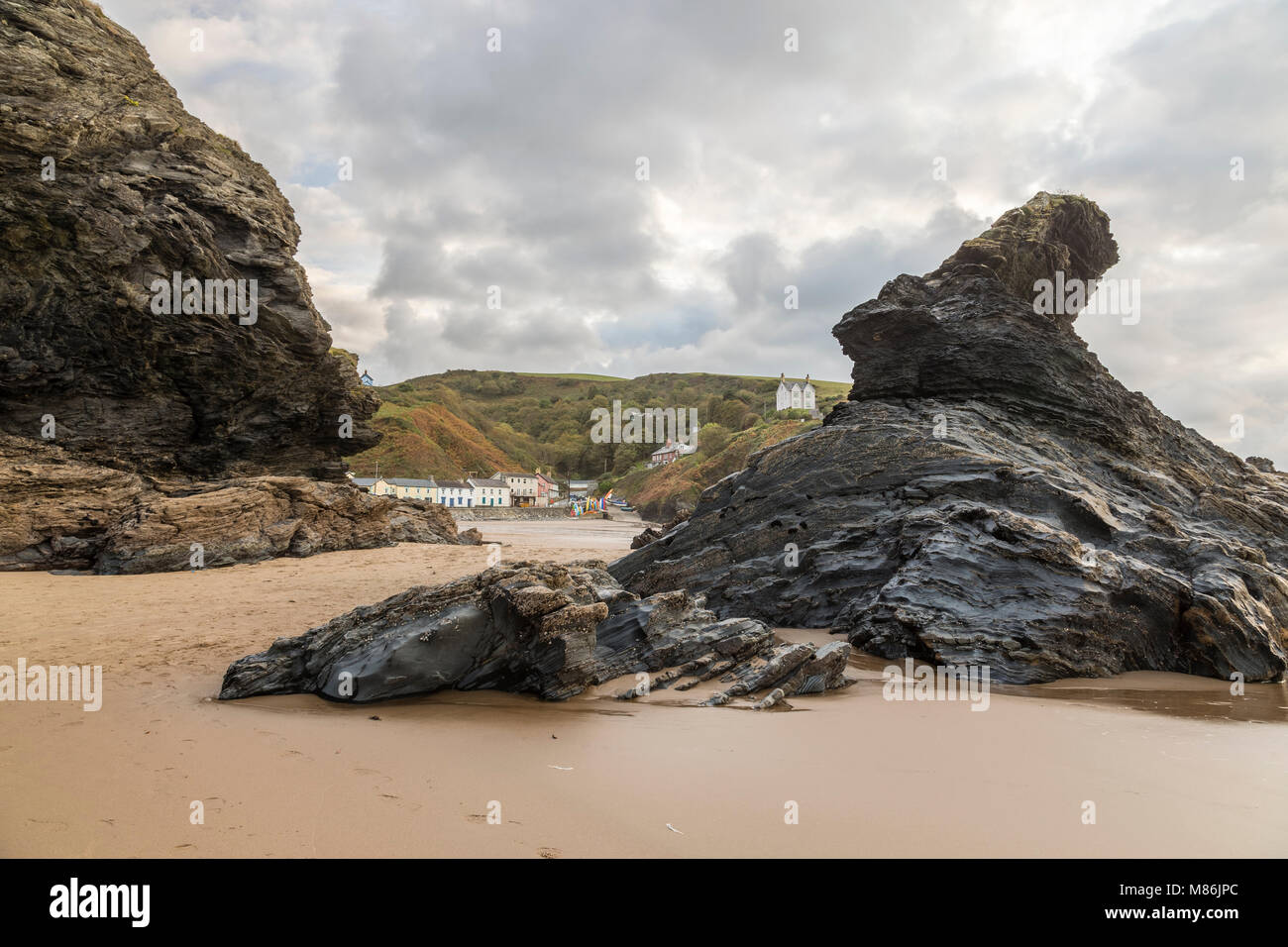 Llangrannog beach at low tide on a cloudy day, Wales coast Stock Photo
