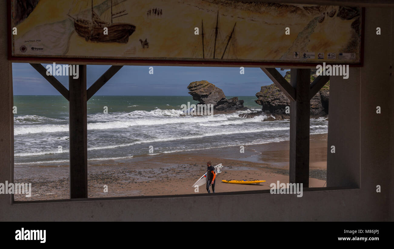 Surfer on the beach at Llangrannog, weales coast Stock Photo