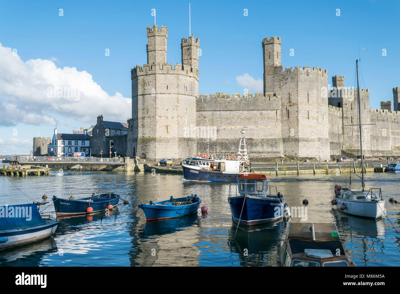 Caernarfon Castle on the North Wales coast Stock Photo