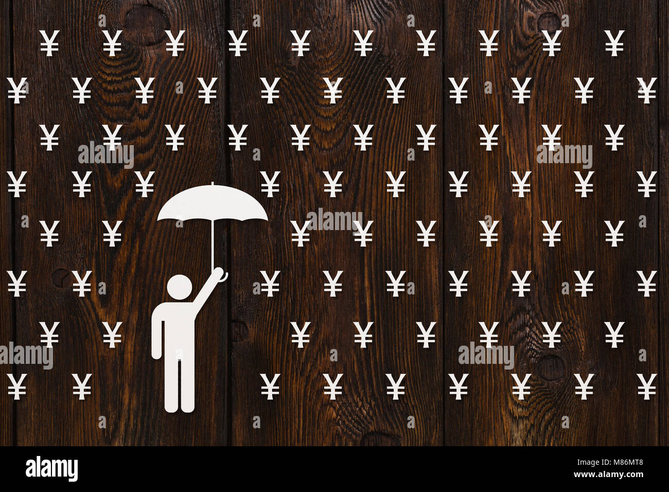 Paper man with umbrella standing in rain of yen, money concept