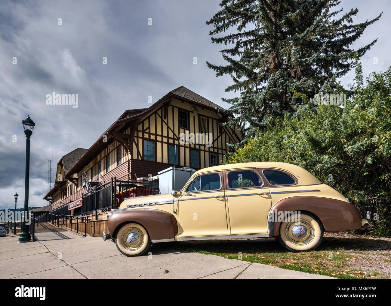 1940s Chevrolet at 1927 Great Northern Railway Depot, Flathead Valley, Whitefish, Montana, USA Stock Photo