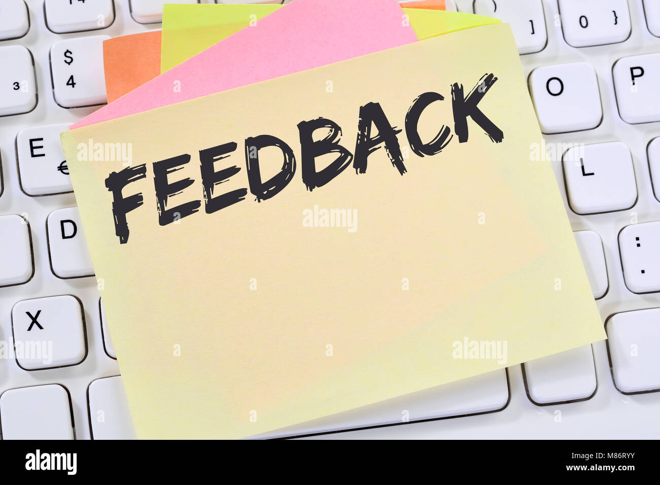 Feedback contact customer service opinion survey business review concept note paper computer keyboard Stock Photo
