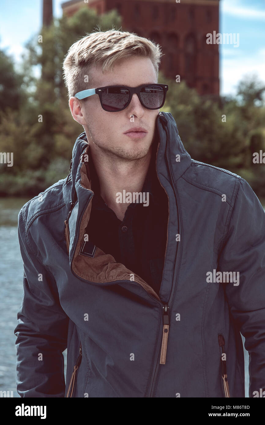 Stylish young handsome man with fancy sunglasses, suny summer day Stock  Photo - Alamy