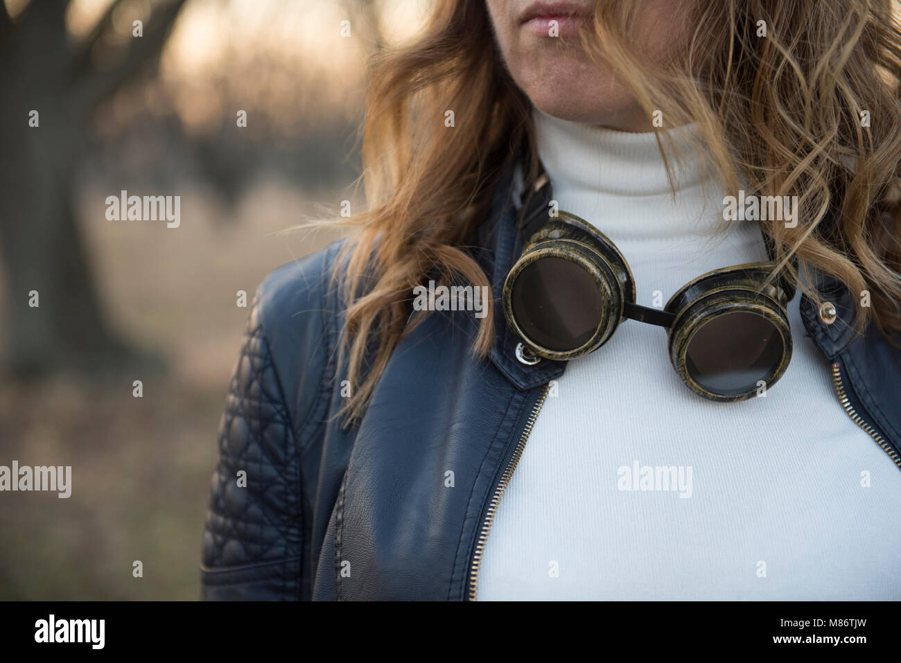 Portrait of a woman with goggles around her neck Stock Photo Alamy